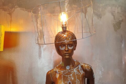 Mannequin home decor lamp with unique bronze tribal design close up